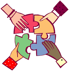 Picture of 4 different hands putting a puzzle together