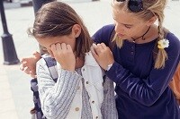 Picture of a child comforting another child